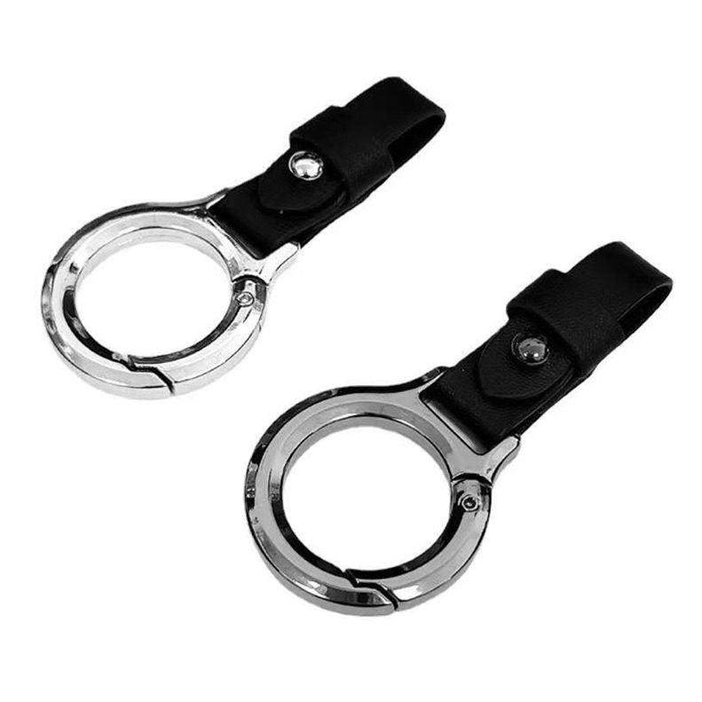 A collage showing a keychain lock attachment in multiple views and color options. The product is a metal ring clip with a strap and a small keychain attached.