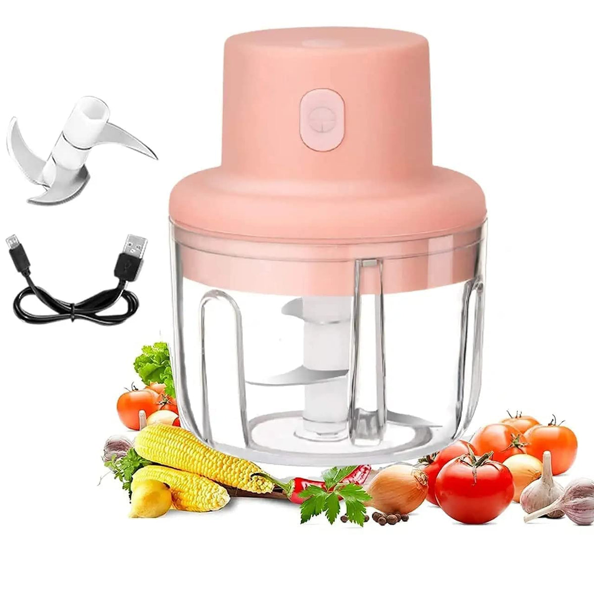 Pink hand blender with attachments and vegetables on a white background