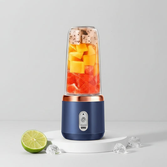 Blue portable blender with fruits and a basket of fruits on a light background